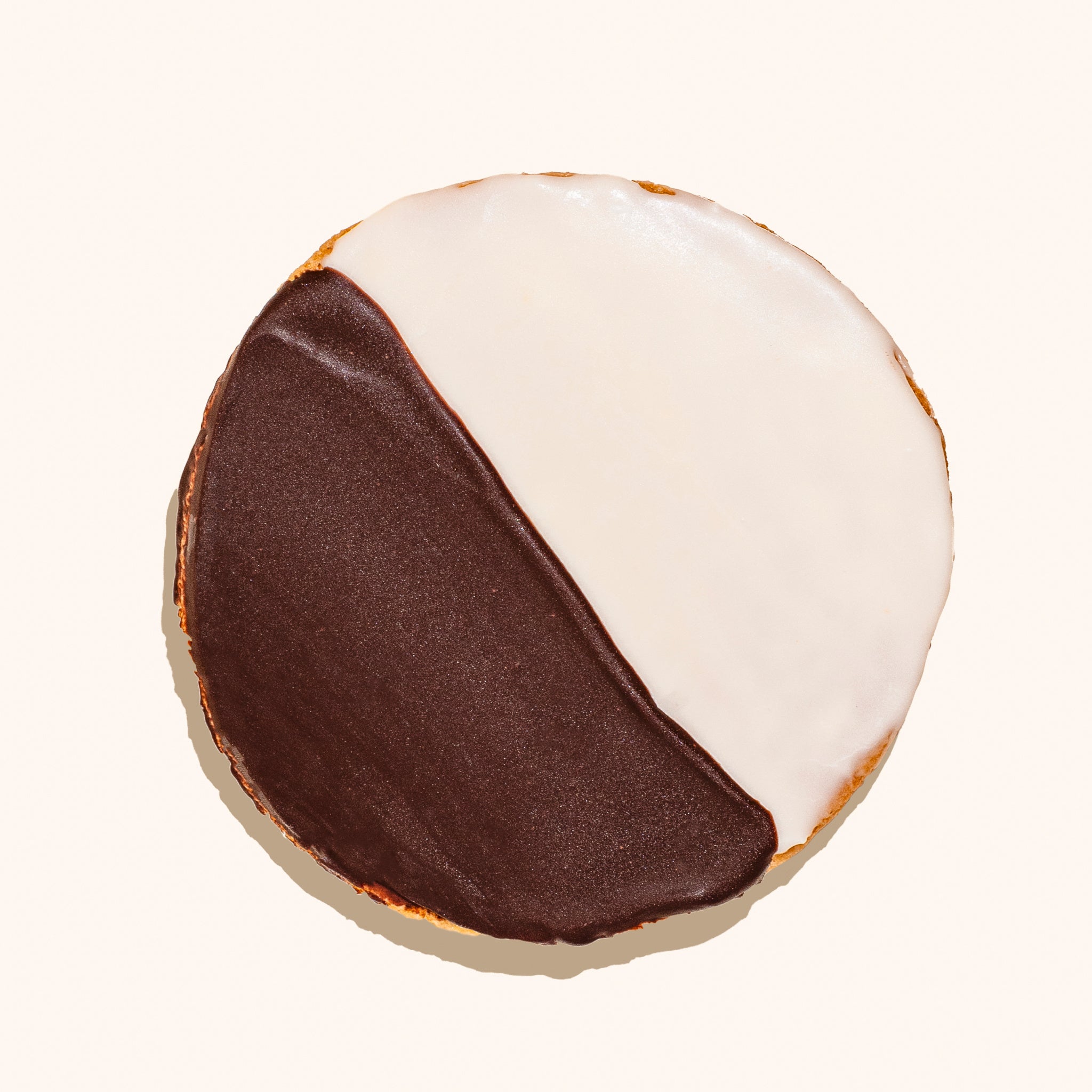 overhead shot of black & white iced cookie
