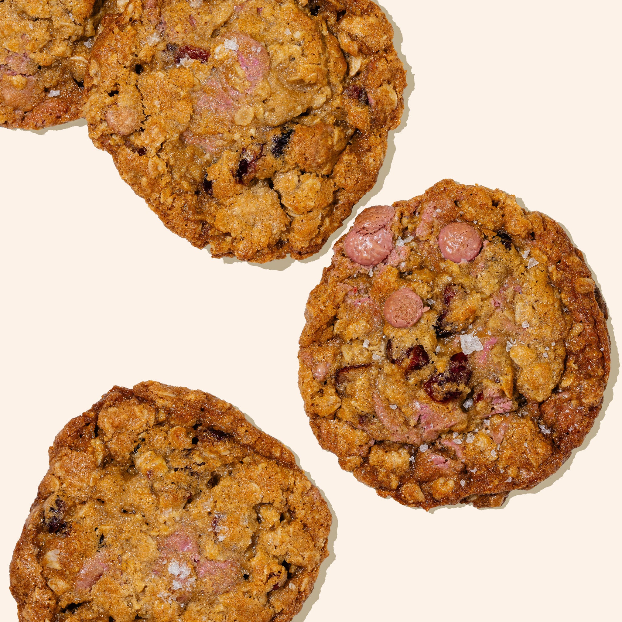Ruby chocolate cranberry oatmeal cookies on a white background