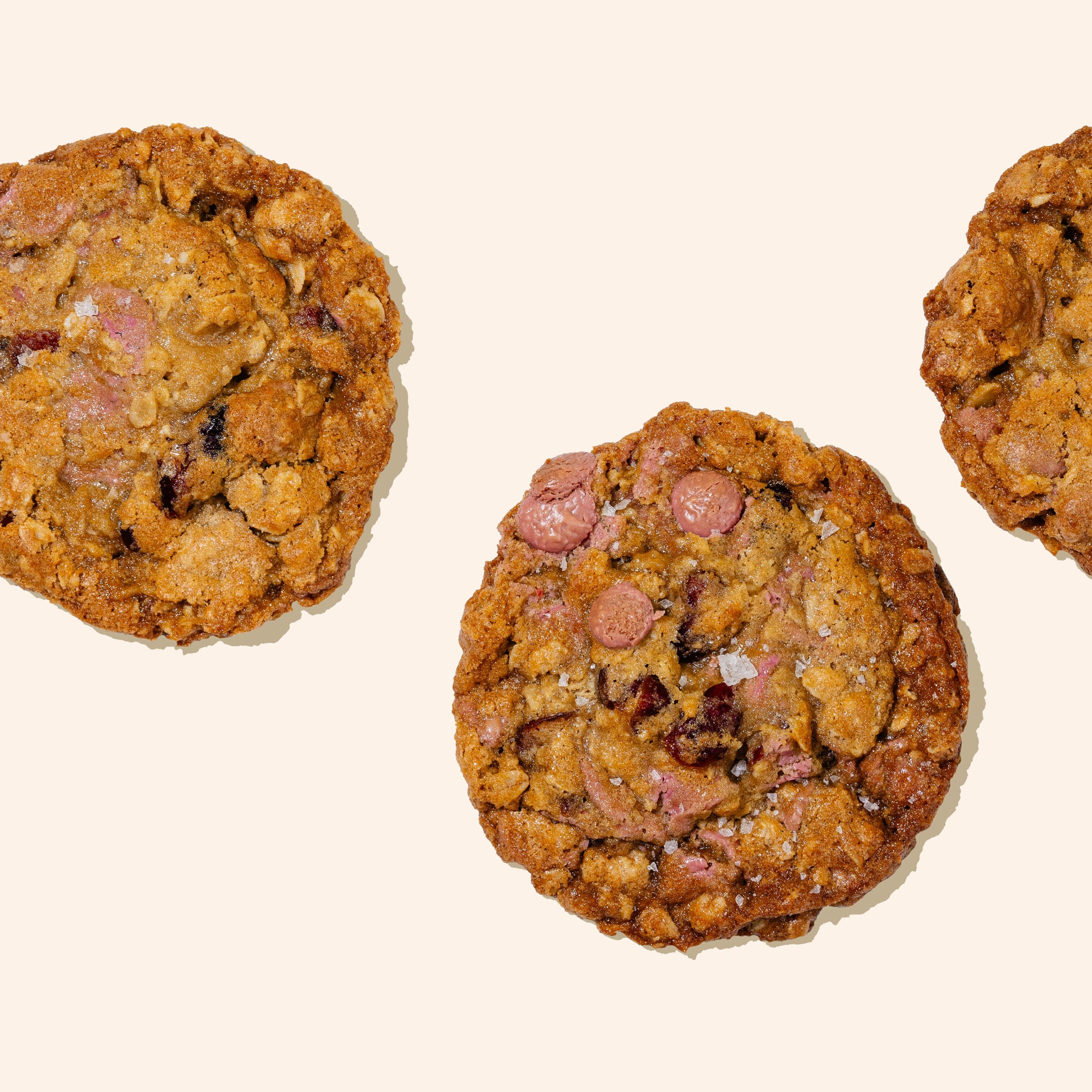 Ruby chocolate cranberry oatmeal cookies on a white background