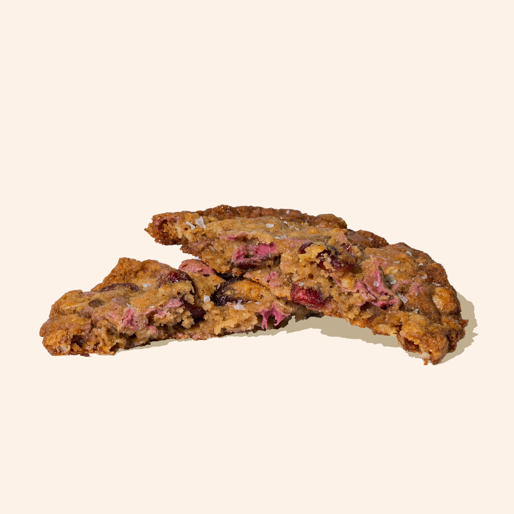 cross section  Ruby chocolate cranberry oatmeal cookies on a white background