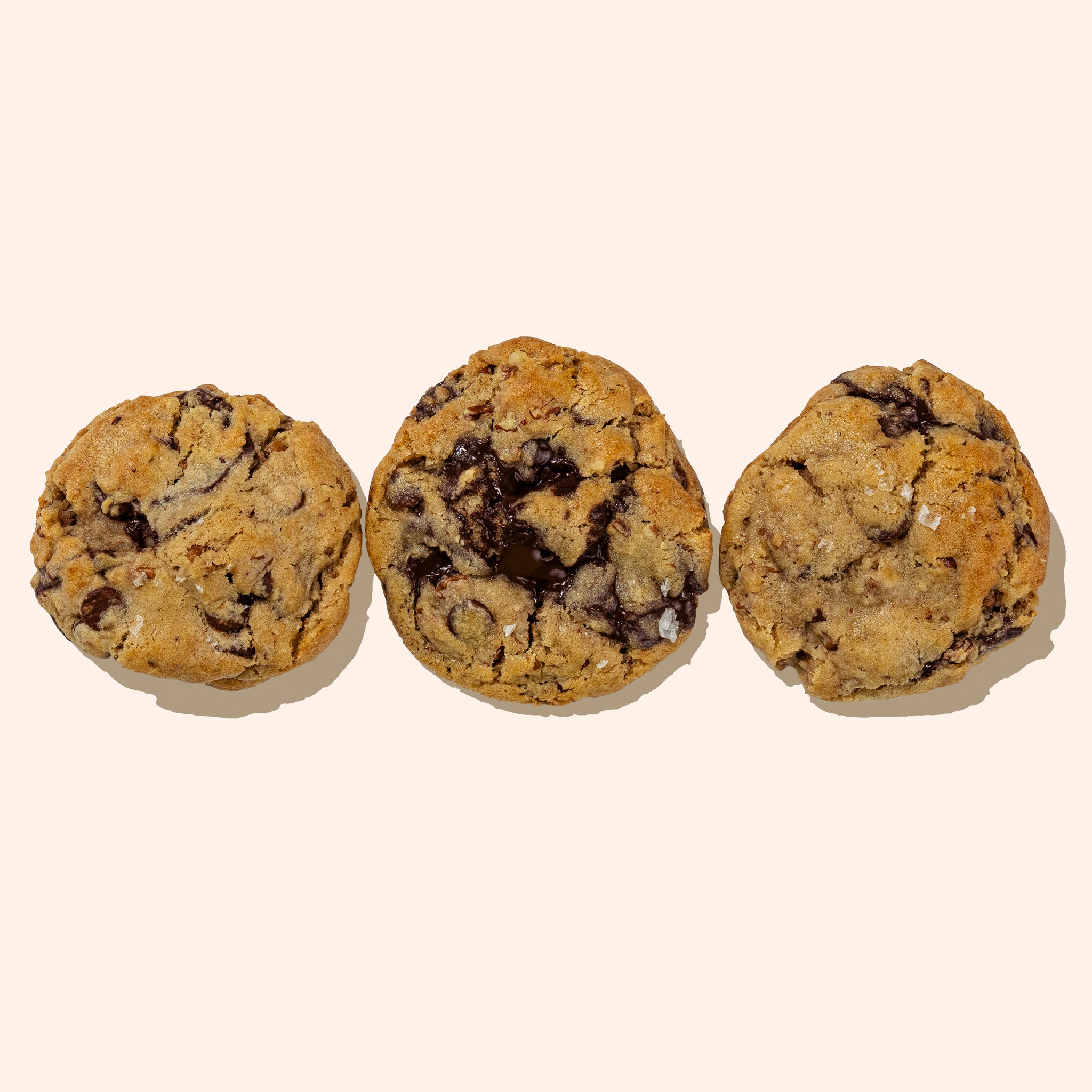row of 3 chocolate chip pecan cookies