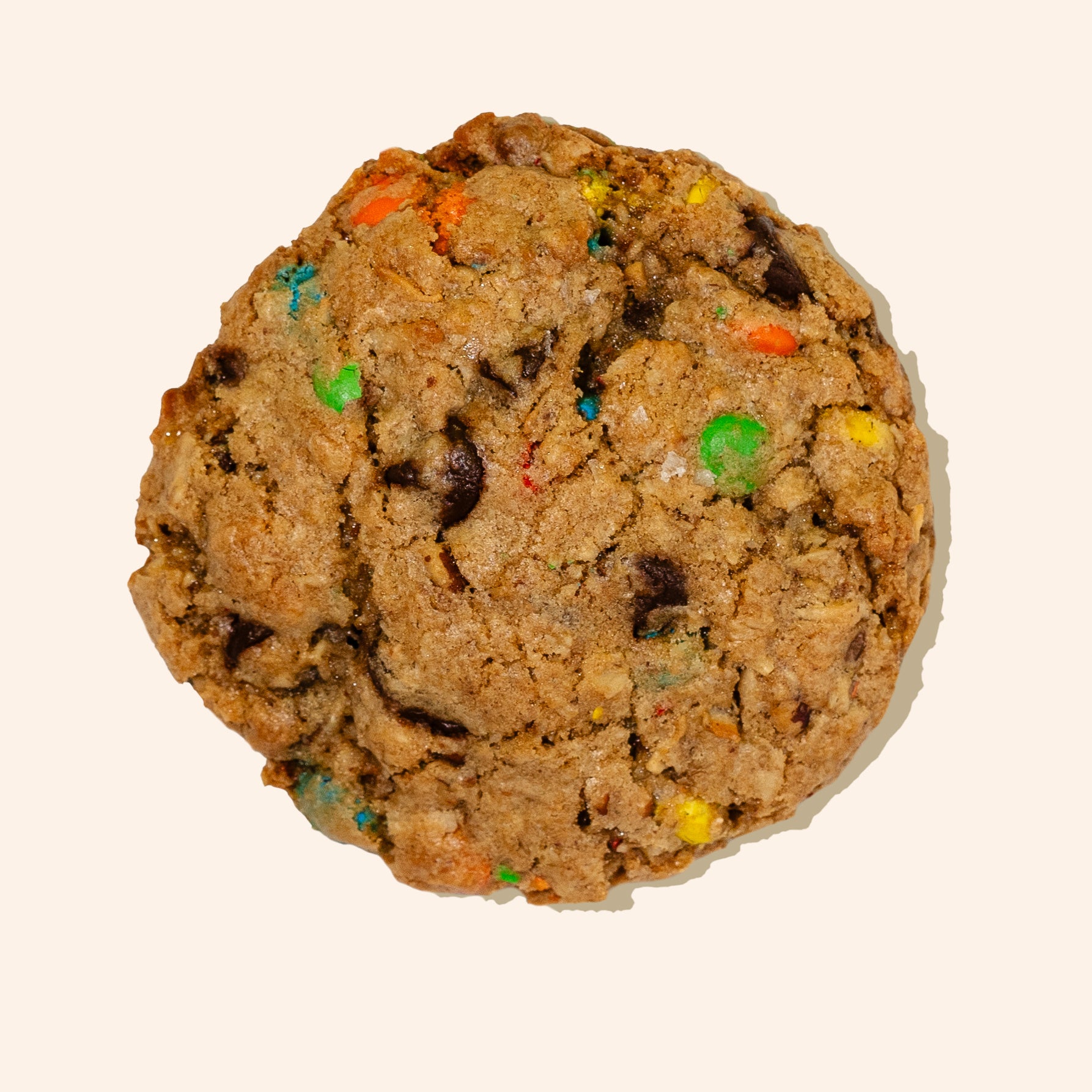 overhead single oatmeal M&M cookies on white background