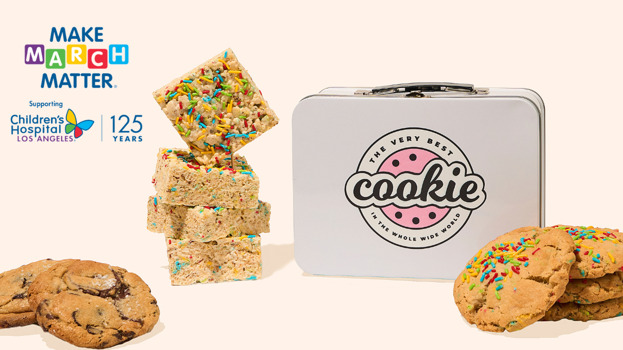 lunch box tin with chocolate chip cookie, sprinkle rice crispy treat, and sprinkle cookie