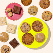 colorful plates with assorted holiday cookies on display