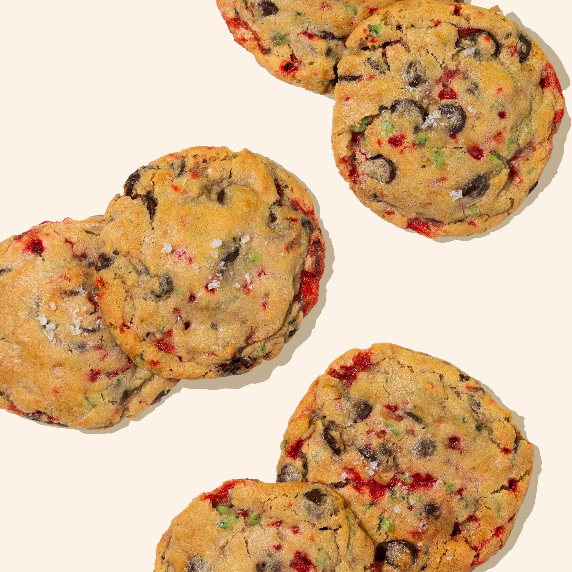 flat lay piles mint chocolate chip cookies on white background