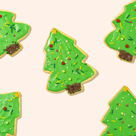 frosted christmas tree sugar cookies on white background
